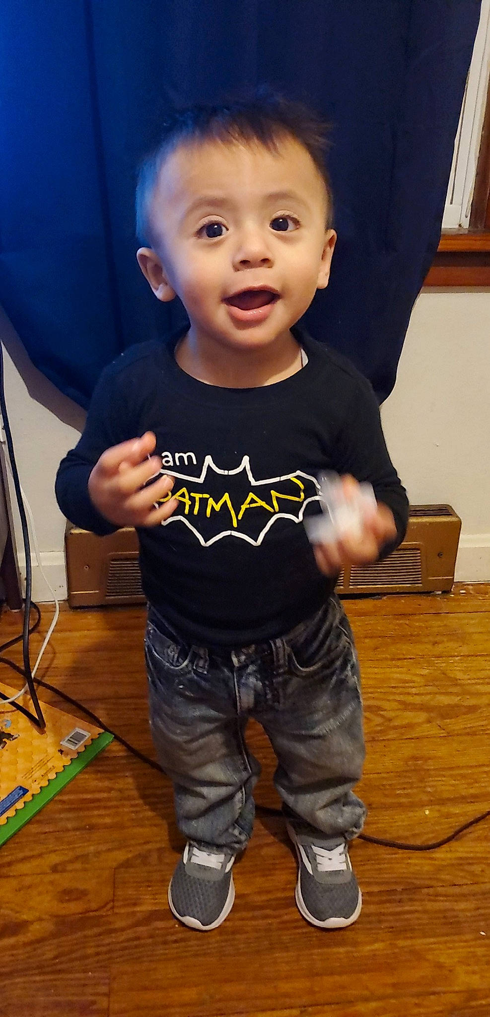 Francisco is registered to the contest to win money with this photo: arm, baby, cheek, child, cool, jeans, person, play, sleeve, smile, standing, t_shirt, toddler, top