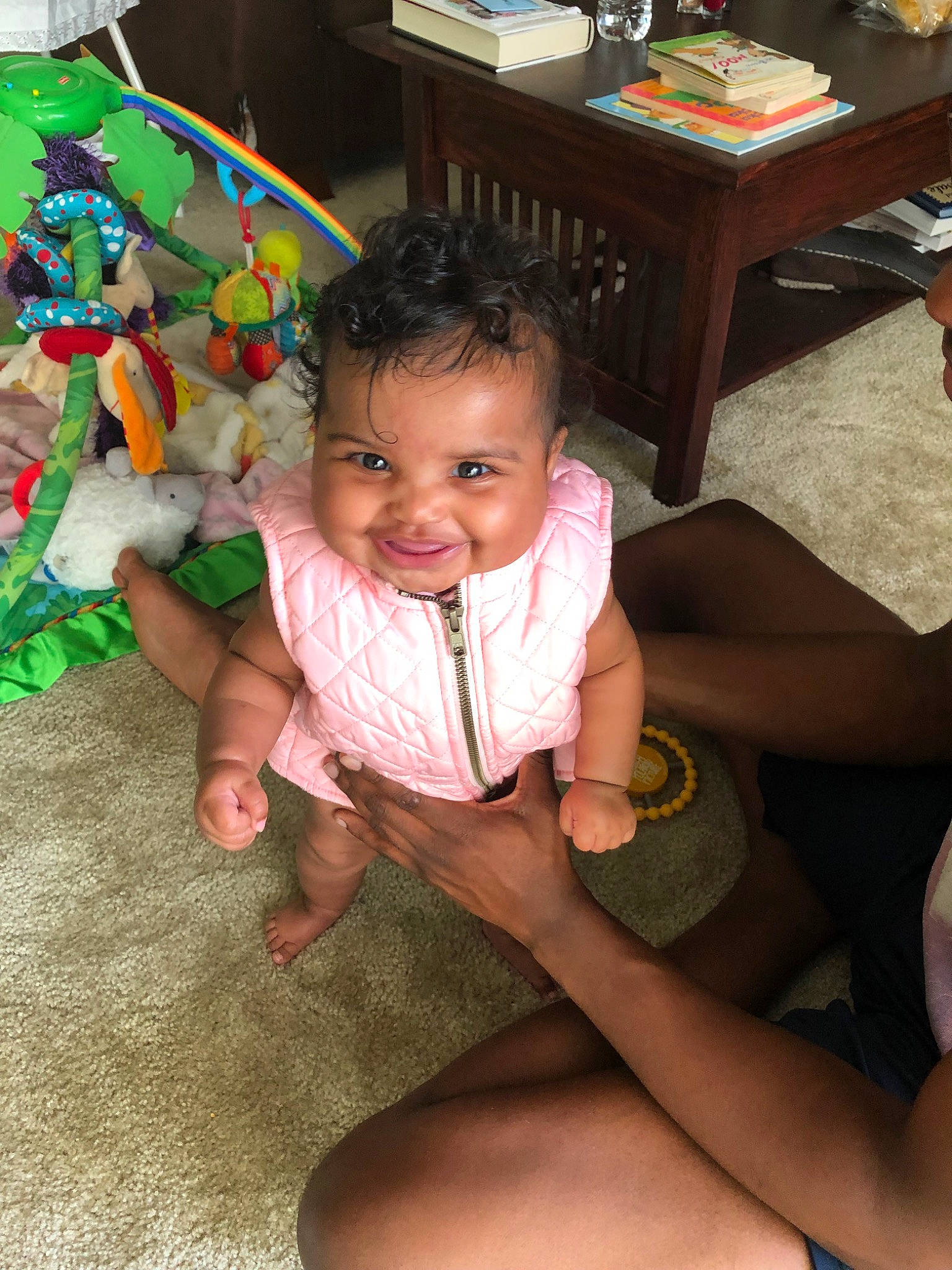 Arreah is registered to the contest to win money with this photo: baby, child, finger, foot, fun, hand, joy, leg, person, play, sitting, skin, smile, thigh, thumb, toddler