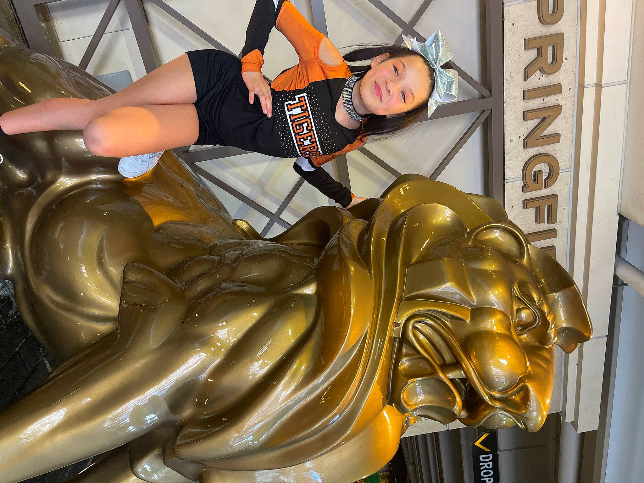 Layla joined the competition — help win amazing prizes! art, automotive_design, bronze, fictional_character, hat, human_body, human_leg, leg, leisure, luggage_and_bags, metal, monument, person, recreation, sculpture, shorts, smile, statue, thigh