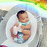 baby, child, infant, baby_seat, floral_clothing, outdoor, sidewalk, grass, rainbow_light, pink_socks, smiling, happy, cute, playful, person, foot, seat, fabric, blanket, sunlight