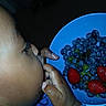 Orion is registered to the contest to win money with this photo: child, baby, toddler, face, hand, hands, fruit, blueberries, strawberries, grapes, bowl, blue_bowl, food, eating, snack, indoor, close_up, portrait, colorful, healthy_food