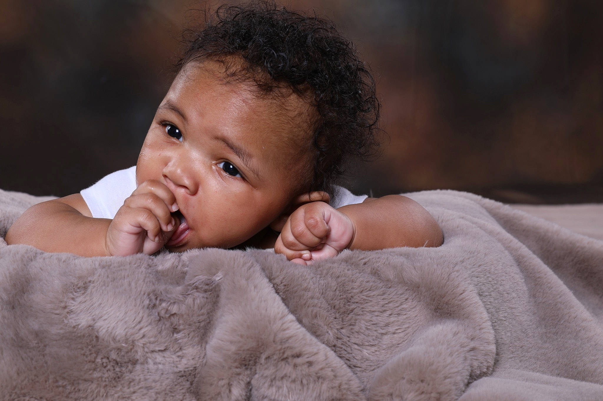 Kristopher is registered to the contest to win money with this photo: baby, baby_toddler_clothing, cheek, child, comfort, eye, finger, flash_photography, gesture, happy, iris, linens, lip, nail, nose, person, skin, sleeve, thumb, toddler