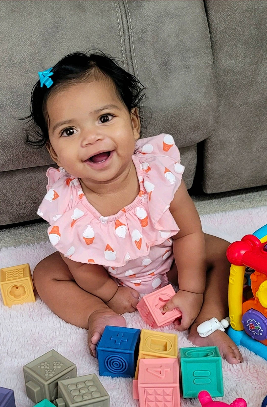 Alora is registered to the contest to win money with this photo: baby, baby_playing_with_toys, baby_toddler_clothing, box, child, fun, happy, joy, pattern, people, person, photography, pink, plastic, play, portrait_photography, sitting, skin, smile, toddler