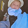 baby, infant, car_seat, hat, bib, pacifier, blanket, blue, clothing, socks, face, child, young, seatbelt, safety, resting, indoors, closeup, cute, newborn