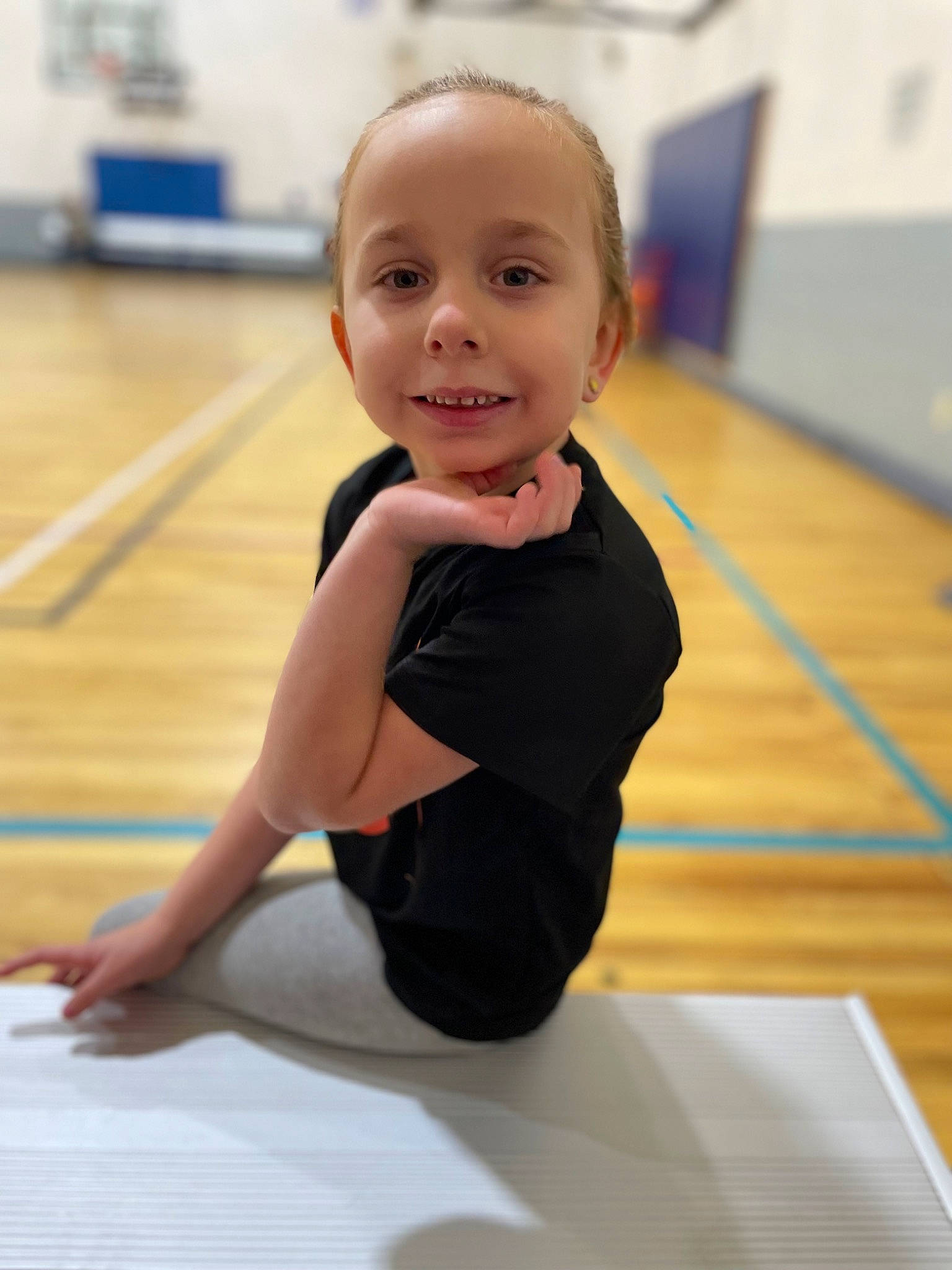 Madelynn is registered to the contest to win money with this photo: balance, child, finger, floor, flooring, fun, happy, hardwood, joint, joy, leisure, person, recreation, shoulder, skin, sleeve, smile, sports, sportswear, thigh