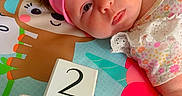 Sophia joined the competition — help win amazing prizes! accessories, baby, businesscard, clothing, cushion, face, furniture, hat, head, indoors, newborn, number, paper, person, photography, portrait, quilt, symbol, t_shirt, text