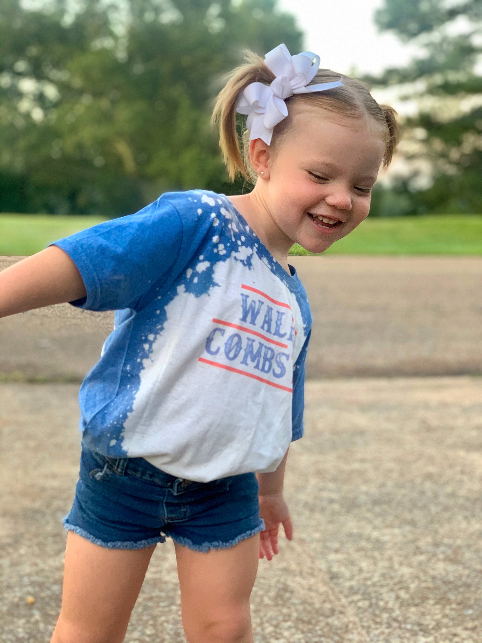Ava-rae is registered to the contest to win money with this photo: blue, child, cool, denim, electric_blue, fun, grass, happy, jeans, joy, person, play, shorts, sleeve, smile, style, summer, t_shirt, textile, toddler