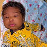 Isayana joined the competition — help win amazing prizes! baby, child, infant, yellow_clothing, onesie, mummy_costume, pumpkin, blanket, animal_prints, sleepy, pout, curly_hair, indoors, cute, lying_down, soft_toys, toddler, portrait, young_child, comfort