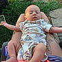 Cleo joined the competition — help win amazing prizes! baby, infant, onesie, tattoos, legs, outdoor, grass, concrete, person, clothing, skin, foot, hand, seat, relaxing, sunlight, nature, cute, casual, colorful