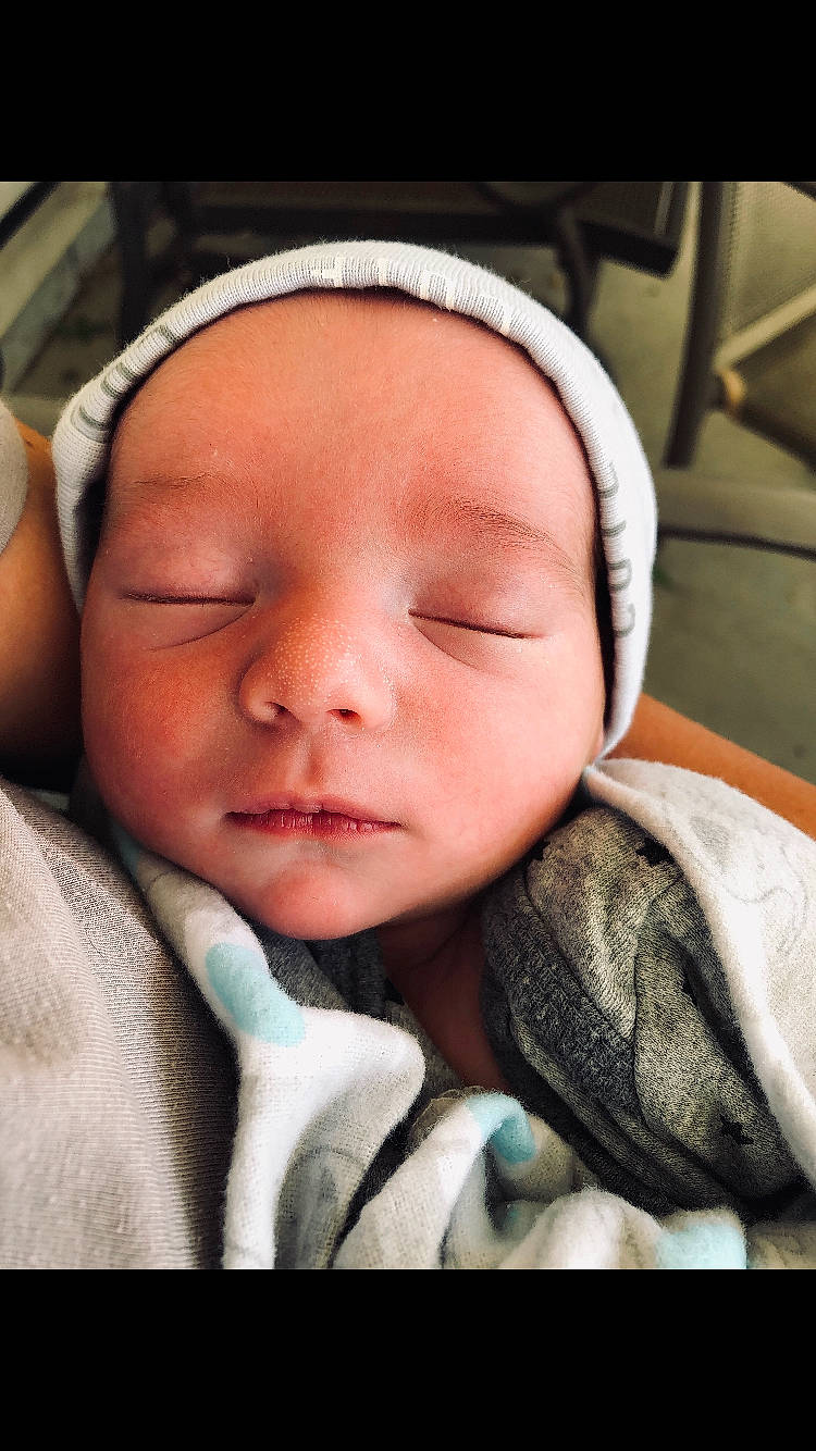 Charles is registered to the contest to win money with this photo: baby, beauty, cheek, child, chin, close_up, eye, eyebrow, face, facial_expression, forehead, hand, head, lip, mouth, nose, person, skin, sleep, smile