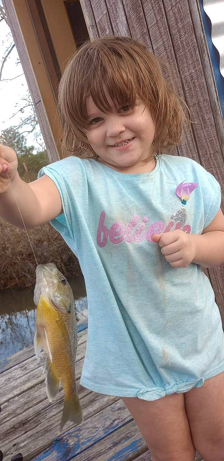 Adaya joined the competition — help win amazing prizes! bangs, child, fin, finger, fish, fisherman, fishing, gesture, grass, happy, joy, person, ray_finned_fish, recreation, recreational_fishing, sleeve, smile, t_shirt, tail, thumb