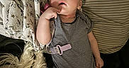 Vivian joined the competition — help win amazing prizes! baby, sleeping, onesie, striped_clothing, blanket, cushion, indoor, resting, peaceful, child, infant, face, hand, comfort, soft_lighting, portrait, relaxation, cozy, cute, young_child