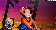 Vivian joined the competition — help win amazing prizes! baby, woman, face_cutout, photo_board, tropical, sunset, aquarium, portrait, smiling, angry_face, costume, flower, vibrant_colors, humor, playful, people, posing, signage, exaggerated_expression, indoor
