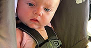 Vivian is registered to the contest to win money with this photo: baby, baby_girl, blanket, car_seat, child, closeup, cute, expression, head, indoors, infant, infant_face, pink_clothing, portrait, safety, seat, seatbelt, skin, soft_light, young_child