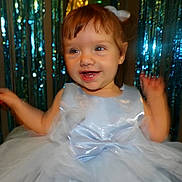 Arabella joined the competition — help win amazing prizes! baby, bodypart, clothing, costume, dress, face, fashion, finger, formalwear, gown, hand, happy, head, indoors, laughing, lighting, mouth, person, photography, portrait