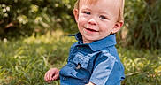 Emmett joined the competition — help win amazing prizes! barefoot, blue_shirt, boy, casual_clothing, child, cute, daylight, grass, greenery, happy, jeans, nature, outdoor, portrait, sitting, smile, sunlight, toddler, trees, young_child