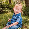 Emmett joined the competition — help win amazing prizes! child, toddler, boy, grass, outdoor, nature, blue_shirt, jeans, barefoot, smile, portrait, sunlight, trees, greenery, casual_clothing, happy, sitting, young_child, daylight, cute