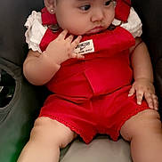 Jaylen joined the competition — help win amazing prizes! baby, child, car_seat, red_overalls, white_shoes, converse, bow, hair_accessory, cute, infant, sitting, clothing, footwear, chubby_cheeks, portrait, indoors, curious, cute_expression, person, baby_fashion