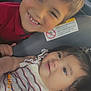 child, baby, car_seat, smiling, cute, portrait, siblings, clothing, indoor, car_interior, happy, face, person, toddler, young_child, closeup, head, seatbelt, safety, family