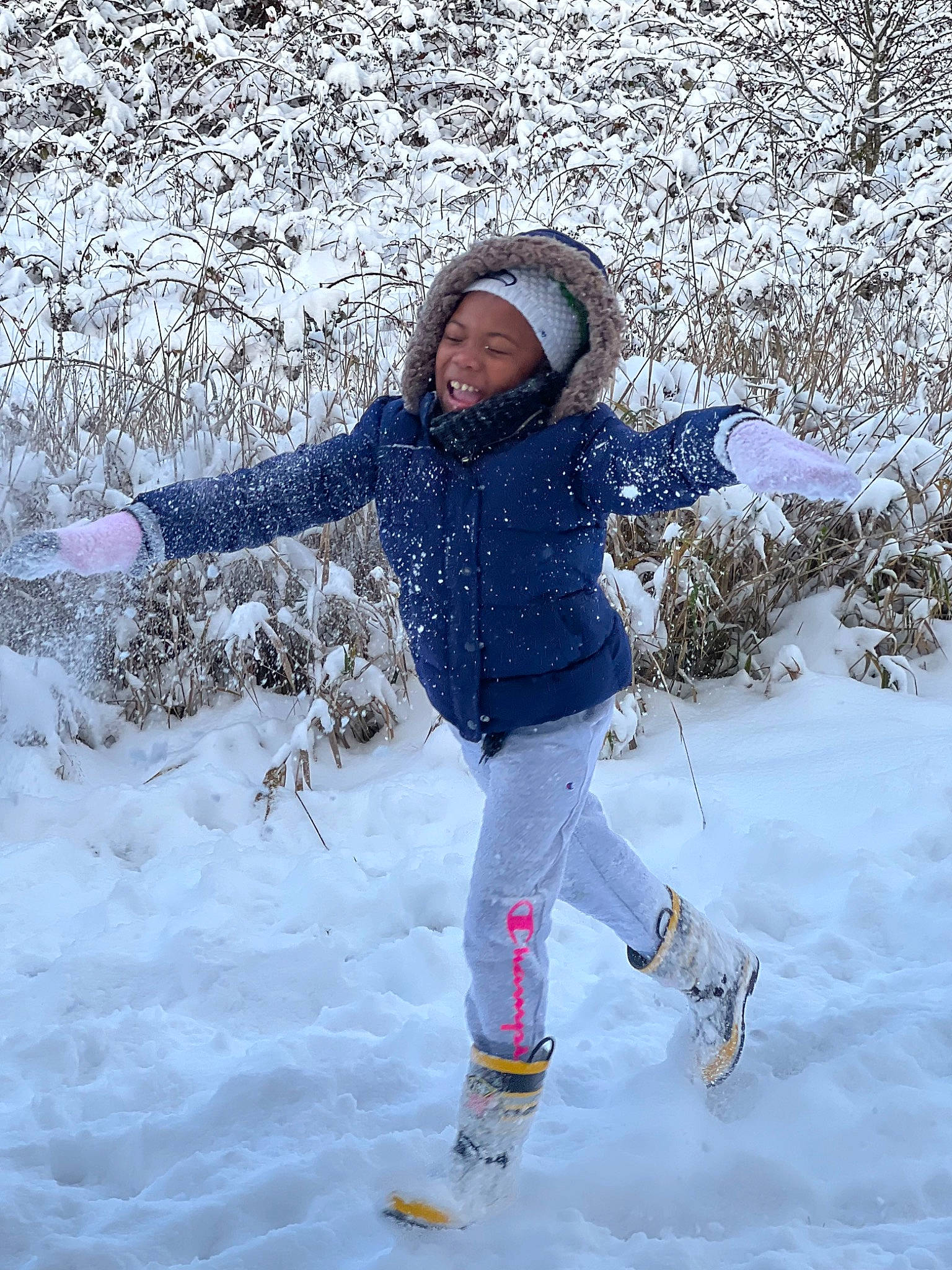 Ayanna joined the competition — help win amazing prizes! electric_blue, freezing, fun, geological_phenomenon, glove, happy, headwear, ice_cap, jacket, landscape, leisure, people_in_nature, person, play, playing_in_the_snow, playing_with_kids, recreation, slope, smile, snow