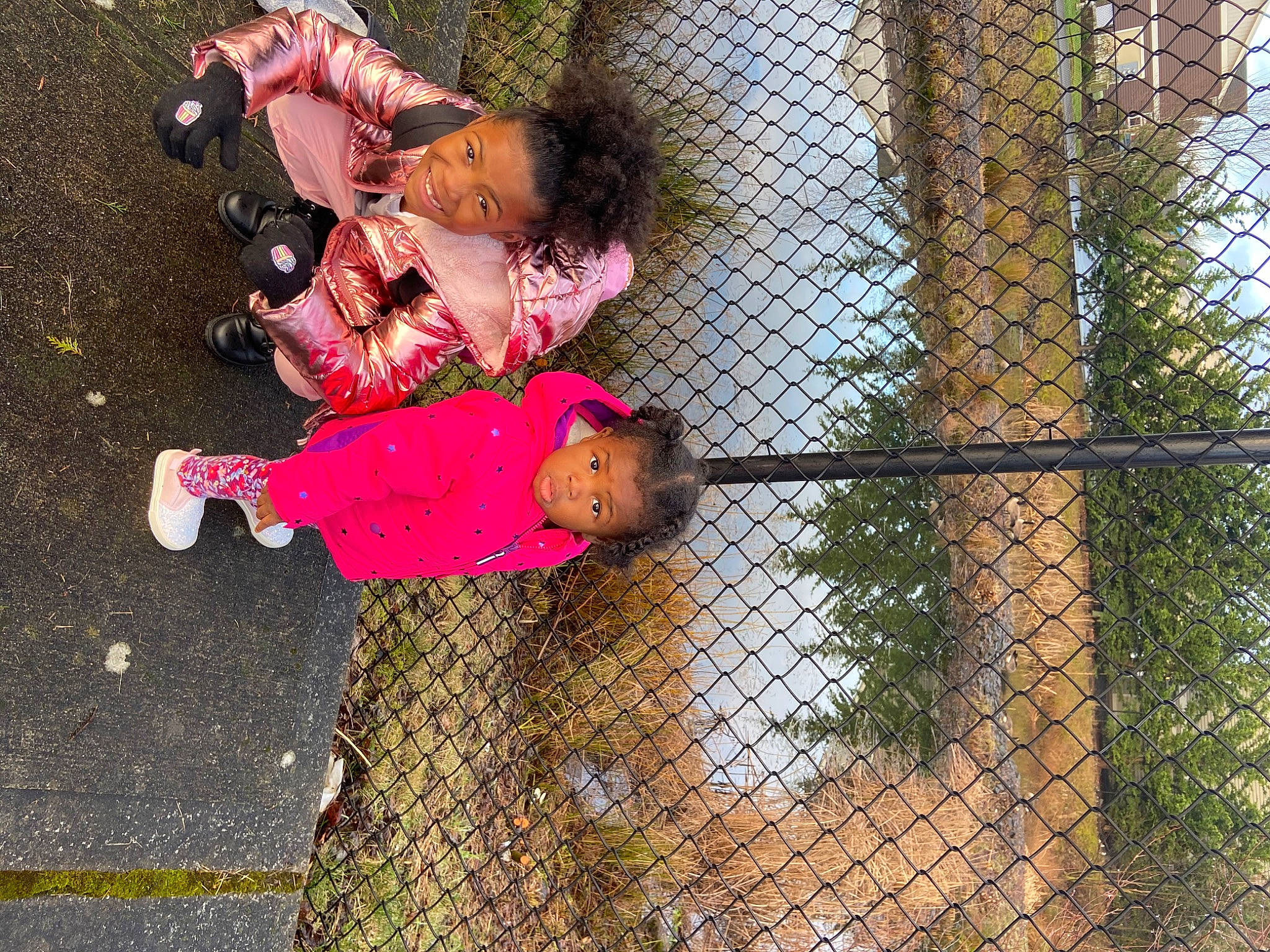 Ayanna is registered to the contest to win money with this photo: baby, chain_link_fencing, child, fence, fun, grass, happy, joy, leisure, magenta, mesh, net, pattern, people_in_nature, person, plant, play, recreation, road_surface, toddler