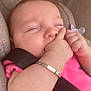 Aria-Louise is registered to the contest to win money with this photo: baby, sleeping, car_seat, pink_clothing, bracelet, hand, face, child, infant, seatbelt, closeup, peaceful, relaxed, indoors, skin, cute, young, resting, portrait, comfort