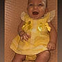 baby, child, smiling, yellow_dress, lace, bows, blanket, happy, infant, cute, portrait, people, skin, hand, legs, sitting, indoors, closeup, person, baby_clothes