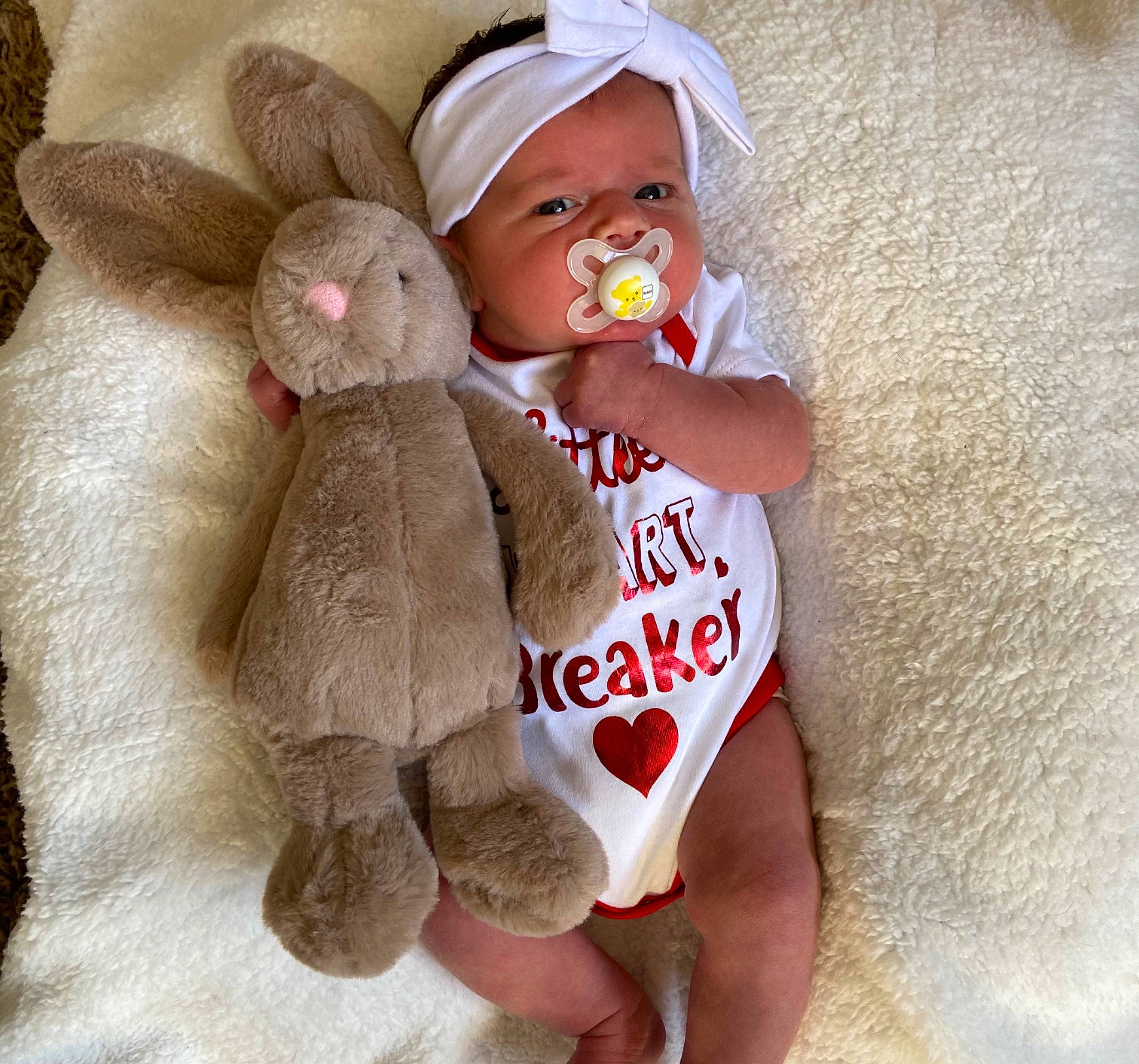 Lily-rose joined the competition — help win amazing prizes! arm, baby_sleeping, cap, child, comfort, doll, fawn, finger, hand, head, headwear, human_leg, leg, nail, person, skin, stuffed_toy, textile, thigh, toy