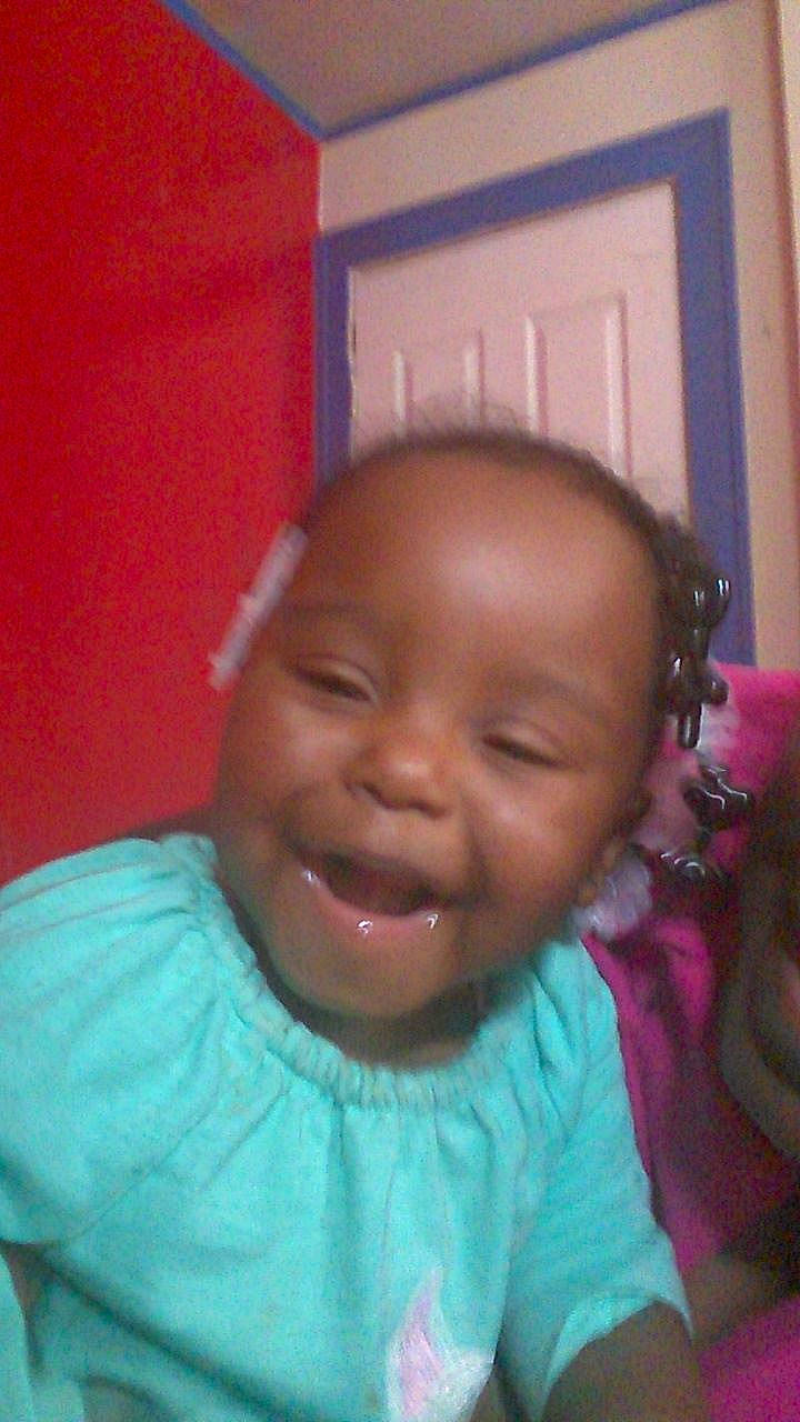 Theadora is registered to the contest to win money with this photo: cheek, child, chin, day, emotion, eye, eyebrow, face, facial_expression, forehead, girl, hair, hairstyle, head, lip, nose, person, pink, skin, smile