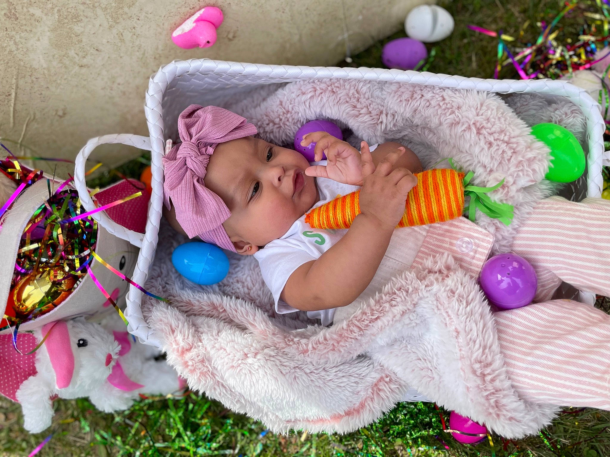 Aloriah is registered to the contest to win money with this photo: baby, baby_products, baby_toddler_clothing, child, comfort, craft, fashion_accessory, fun, grass, green, headwear, linens, magenta, pattern, person, pink, purple, room, textile, toddler