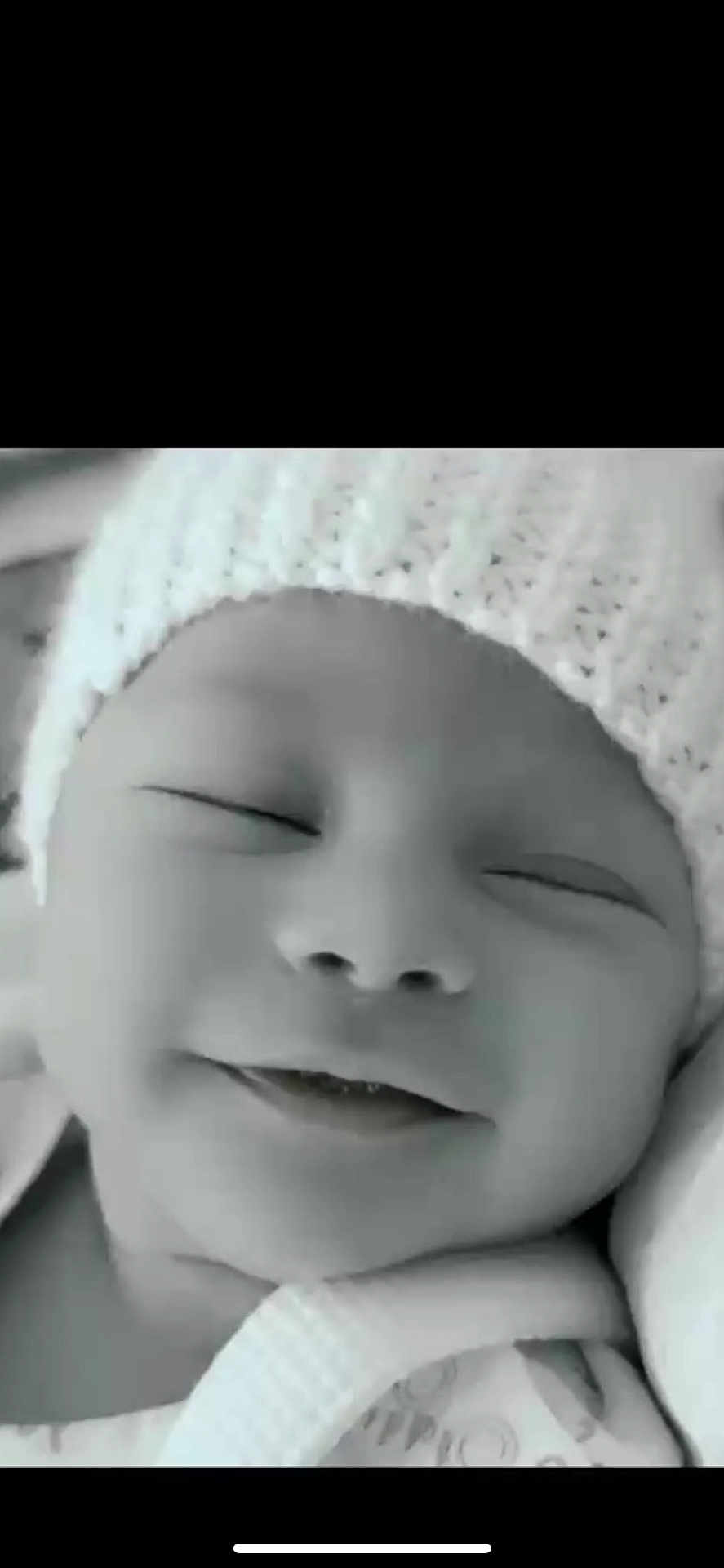 Lucas is registered to the contest to win money with this photo: baby, infant, sleeping, hat, knitted_hat, close_up, face, smile, peaceful, black_and_white, newborn, soft_texture, cute, portrait, child, cozy, blanket, rest, young, headwear