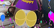 Duchess Marie joined the competition — help win amazing prizes! dog, party_hat, birthday, glasses, balloons, confetti, deck, wood, planters, outdoor, celebration, festive, brown_dog, resting, decorations, digital_overlay, colorful, pet, fun, relaxed