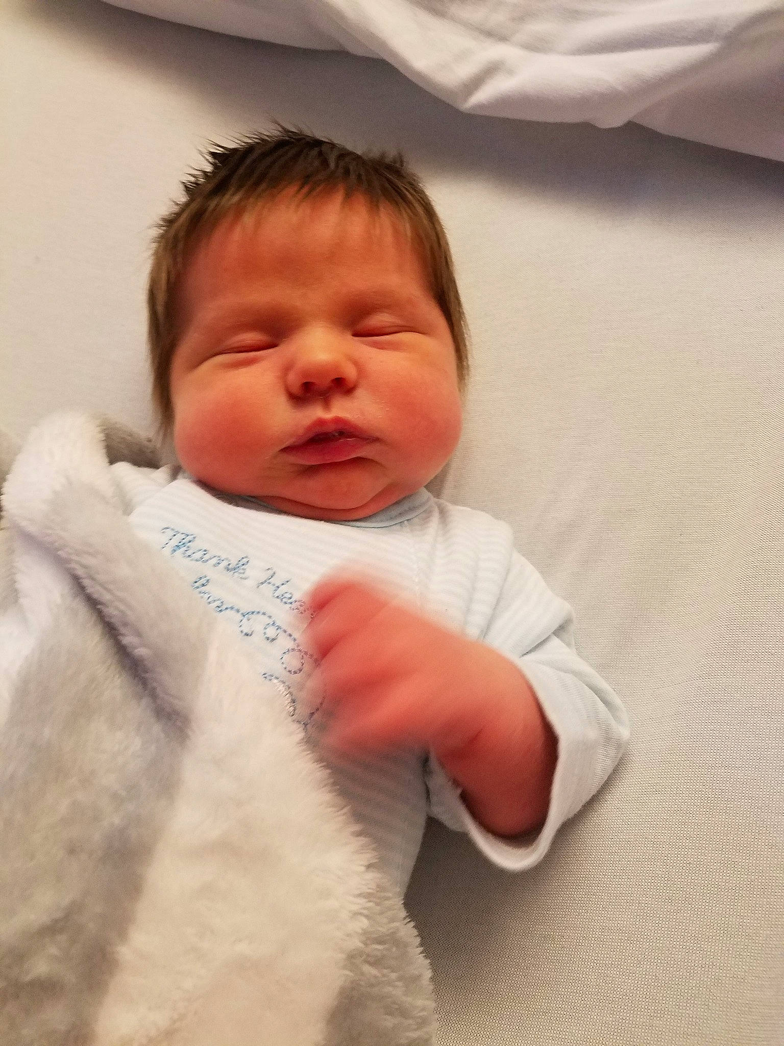 Judson is registered to the contest to win money with this photo: cheek, child, ear, face, head, infant, lip, nose, person, product, skin, sleep, smile, textile, toddler