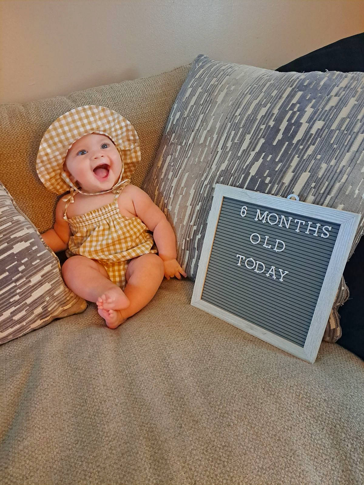 Amber Rayne is registered to the contest to win money with this photo: art, baby, baby_toddler_clothing, child, comfort, electronic_device, fashion_accessory, flooring, foot, headwear, human_leg, illustration, linens, pattern, person, room, sitting, table, thigh, toddler