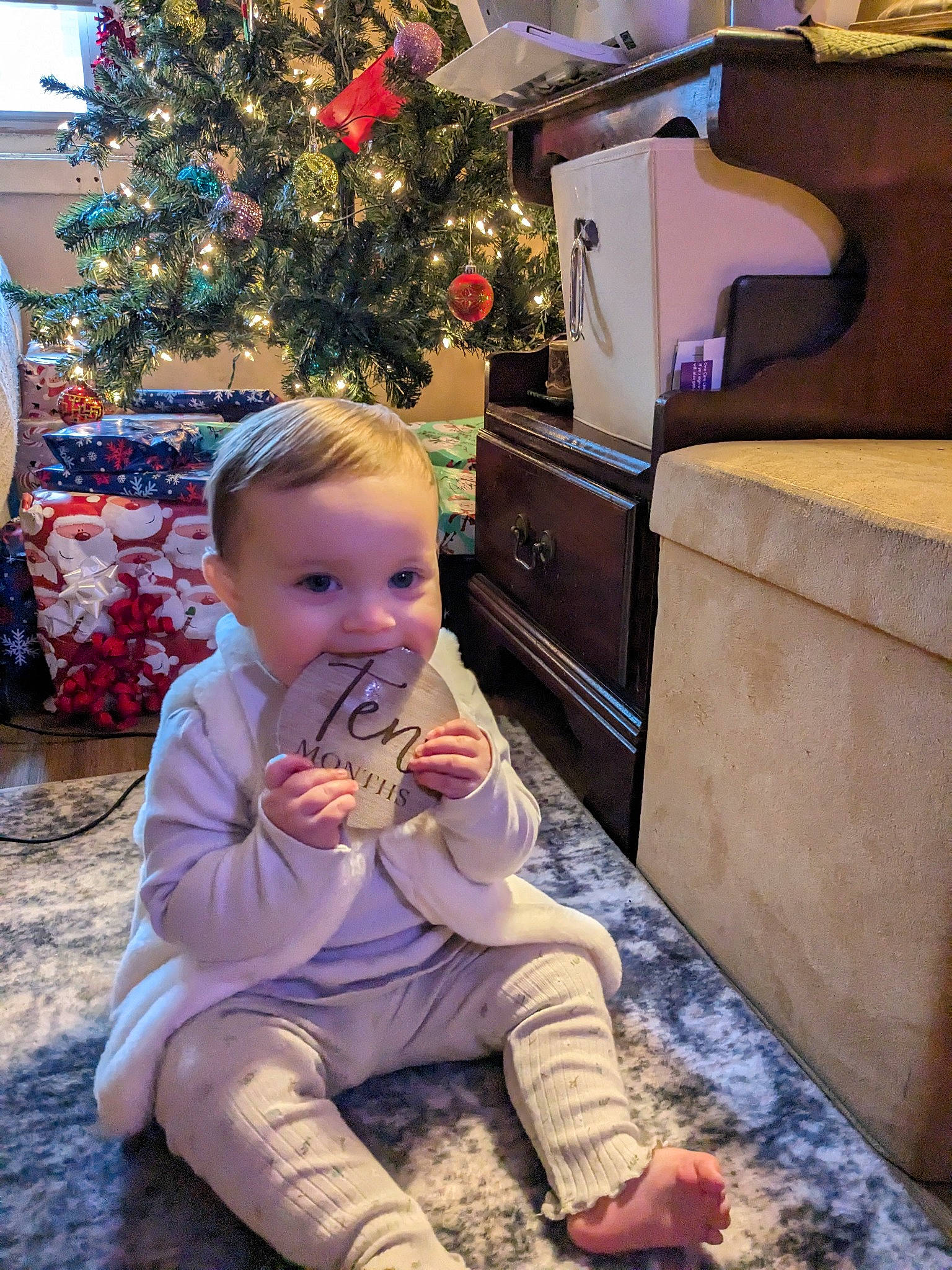 Amber Rayne joined the competition — help win amazing prizes! baby, baby_toddler_clothing, child, christmas, christmas_decoration, christmas_eve, christmas_tree, event, flooring, happy, holiday, lap, living_room, ornament, person, photograph, room, sitting, snapshot, toddler