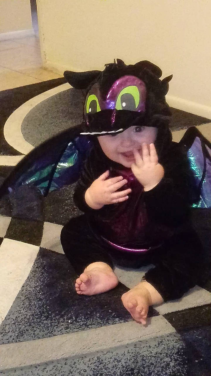 Graysen joined the competition — help win amazing prizes! asphalt, baseball_cap, cap, cool, costume, costume_hat, eyewear, fashion_accessory, flooring, fun, goggles, hat, headwear, human_leg, person, personal_protective_equipment, purple, road_surface, sitting, t_shirt