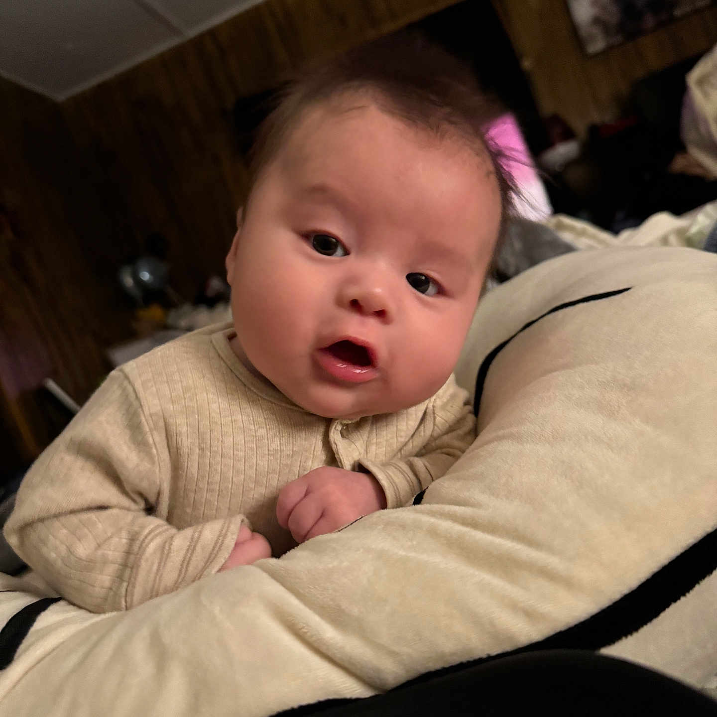 Treyvon joined the competition — help win amazing prizes! baby, candid, child, clothing, cozy, curious, cute, expression, face, furniture, home, indoors, infant, person, plush_pillow, portrait, relaxed, soft_toys, wooden_wall, young_child