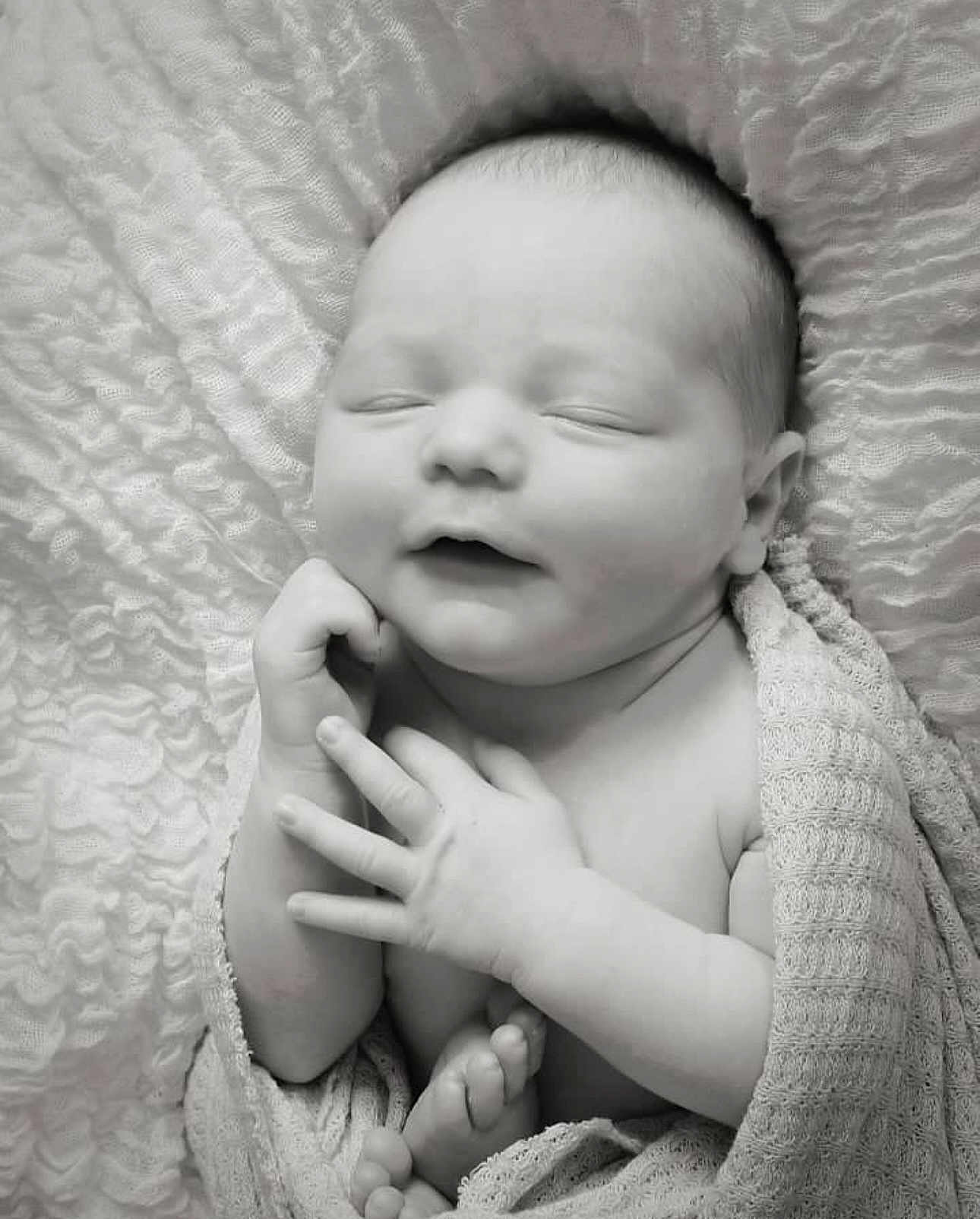 Jasper is registered to the contest to win money with this photo: baby, newborn, sleeping, blanket, wrapped, black_and_white, peaceful, infant, cute, soft_texture, fingers, toes, closeup, portrait, child, sleep, serene, resting, cocooned, toddler