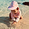 Maë participe au concours pour gagner de l'argent avec cette photo : beach, child, clothing, curious, cute, exploring, nature, outdoor, pink_hat, playful, sand, sea, shallow_water, summer, sunlight, sunny, toddler, vacation, water, waves
