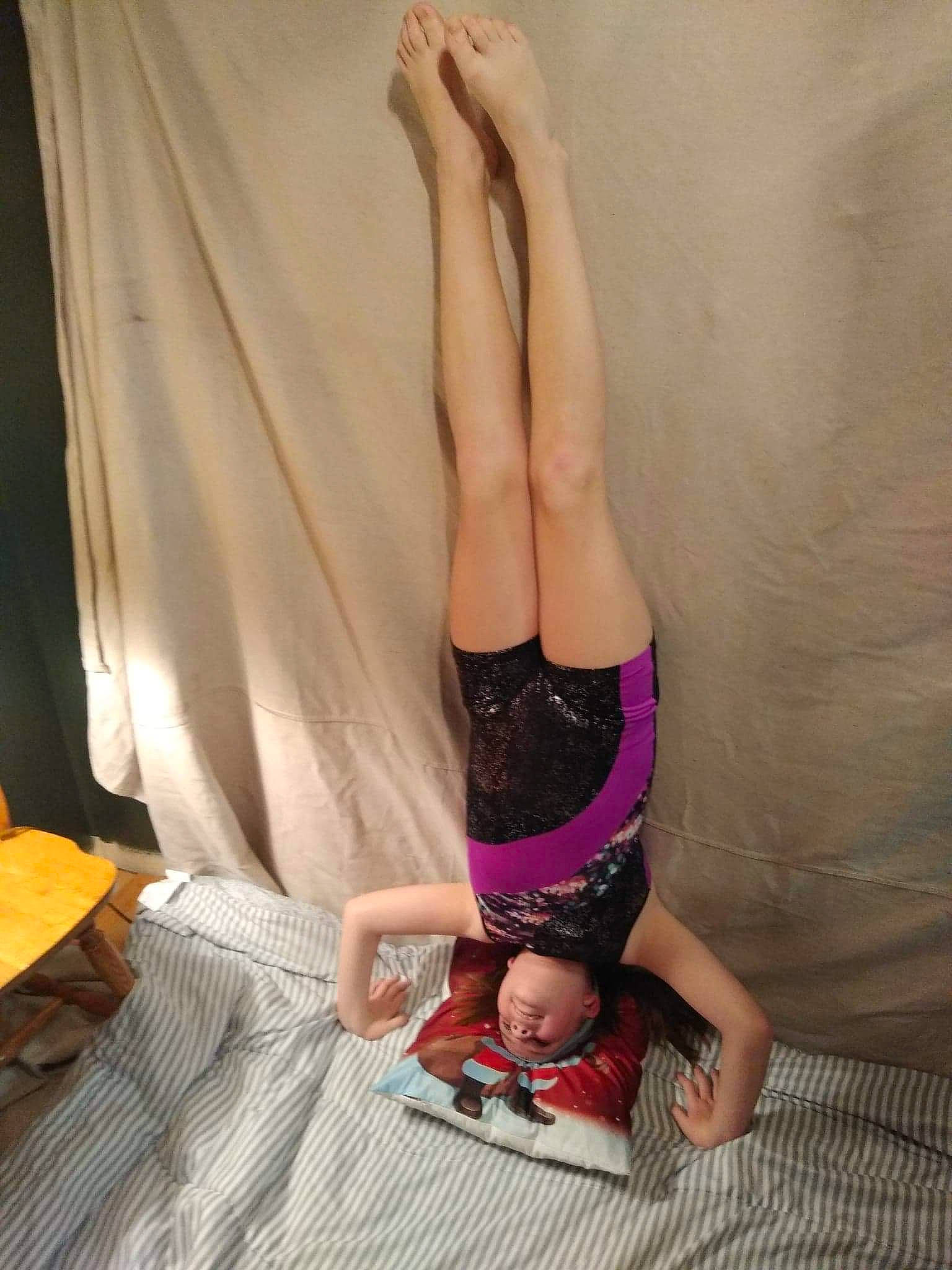 Abigail is registered to the contest to win money with this photo: abdomen, barefoot, calf, chest, comfort, elbow, exercise, floor, flooring, foot, hardwood, human_body, knee, person, physical_fitness, sportswear, thigh, trunk, waist, wood