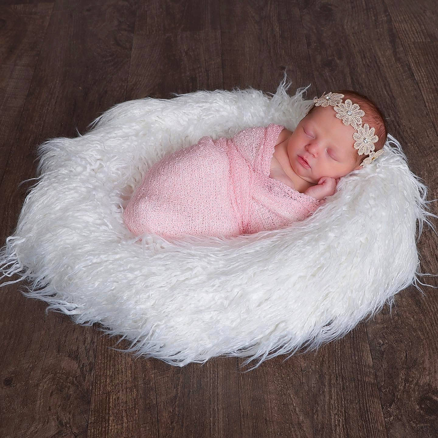 Ava is registered to the contest to win money with this photo: baby, baby_toddler_clothing, beanie, comfort, creative_arts, crochet, embellishment, eye, fashion_accessory, fur, hair_accessory, head, headwear, knit_cap, knitting, linens, person, sitting, toddler, wood