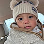 baby, child, hat, mickey_mouse, pom_poms, jacket, sherpa, cozy, face, eyes, car_interior, seat, clothing, winter_wear, cute, portrait, young_child, warm, close_up, infant
