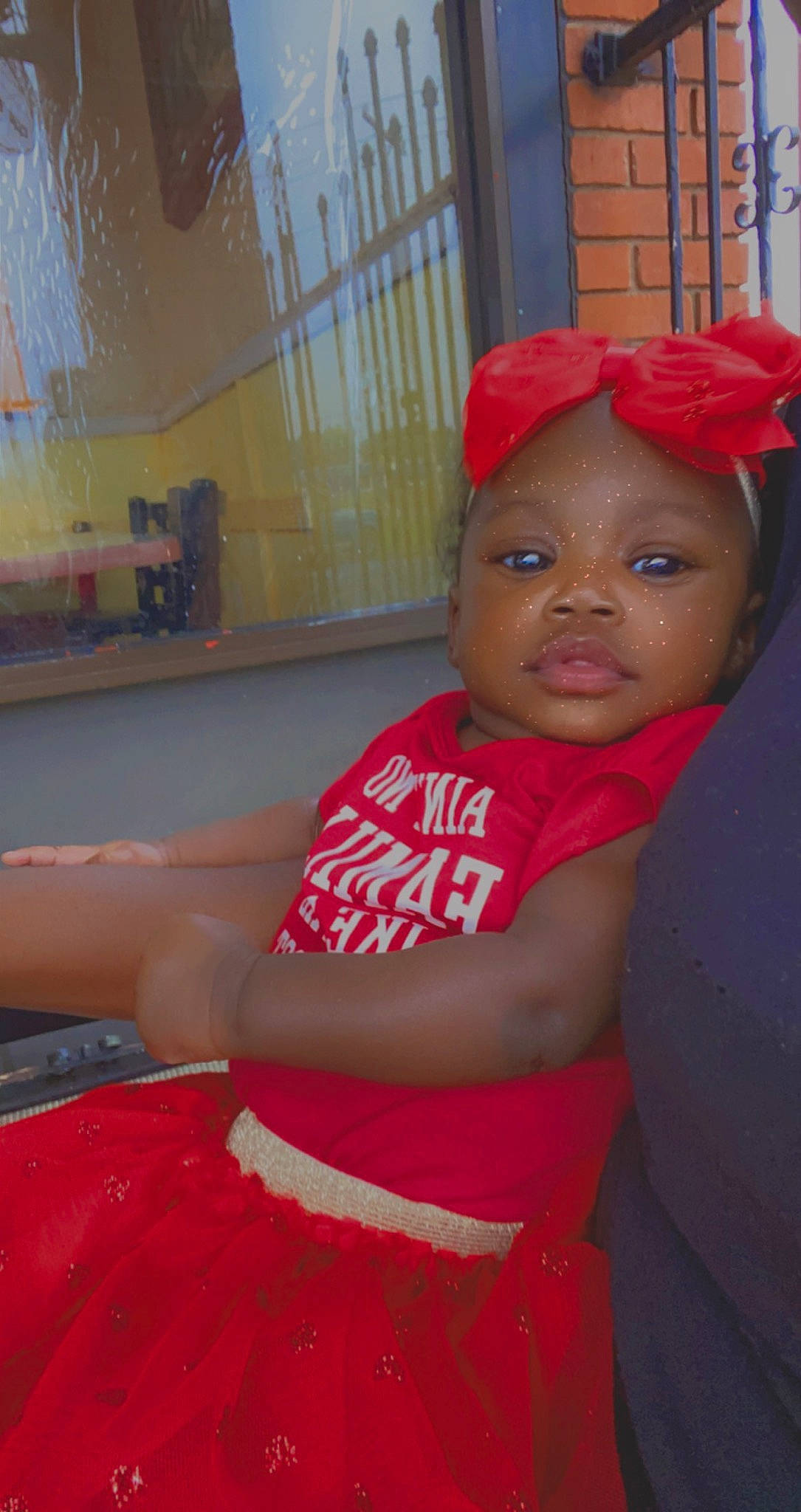 Cassidy is registered to the contest to win money with this photo: baseball_cap, black_hair, cap, chest, child, chin, elbow, facial_expression, fun, happy, hat, human_leg, leisure, lip, magenta, mouth, person, t_shirt, thigh, toddler