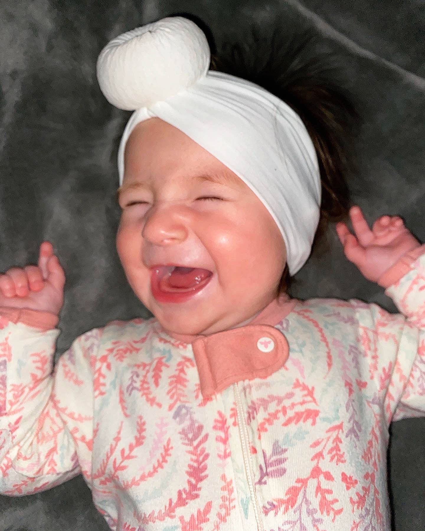 Austyn is registered to the contest to win money with this photo: arm, cheek, chin, ear, eye, face, gesture, hand, happy, head, headwear, human_body, lip, mouth, neck, nose, person, pink, skin, sleeve