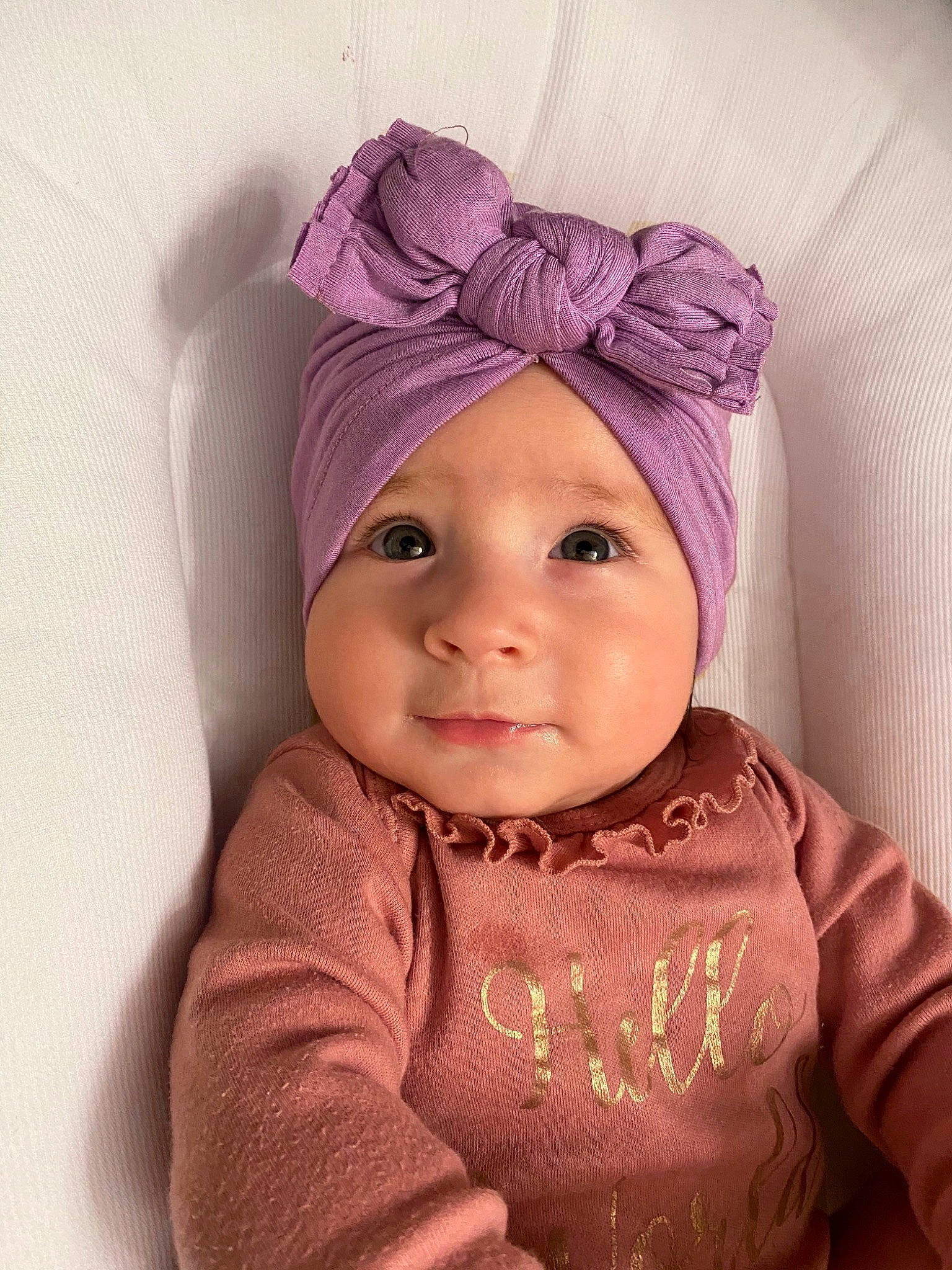Austyn is registered to the contest to win money with this photo: baby, baby_toddler_clothing, cap, chin, clothing, eye, eyebrow, happy, head, headgear, headwear, helmet, knit_cap, lip, outerwear, person, pink, skin, sleeve, smile