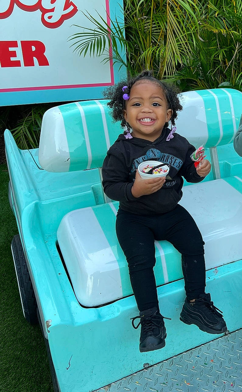 Makai joined the competition — help win amazing prizes! auto_part, automotive_design, automotive_exterior, automotive_tire, automotive_wheel_system, bumper, chair, comfort, electric_blue, green, happy, joy, leisure, motor_vehicle, person, sitting, smile, tire, toddler, vehicle