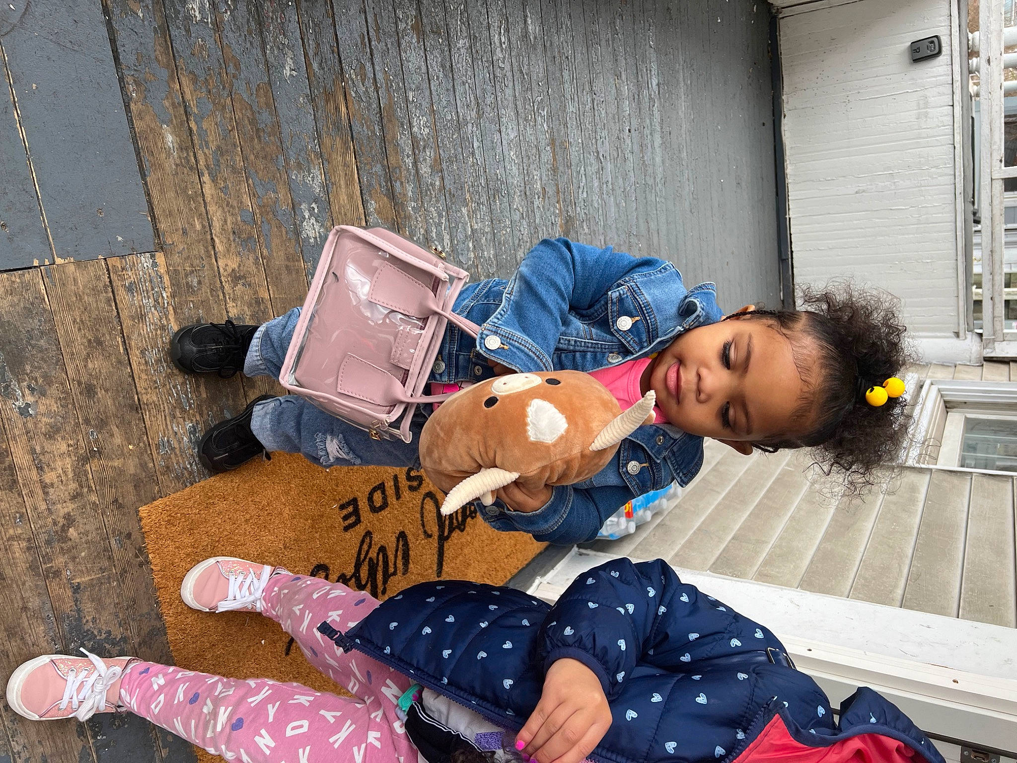 Makai is registered to the contest to win money with this photo: bag, carmine, child, comfort, fashion_accessory, flooring, foot, fun, human_leg, knee, lap, leisure, luggage_and_bags, pattern, person, photograph, play, sitting, thigh, toddler