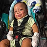 Ghalil is registered to the contest to win money with this photo: animal_print, baby, baby_toys, blanket, car_seat, child, clothing, comfort, cute, indoors, infant, mittens, person, portrait, rosy_cheeks, safety, seat, smile, straps, young_child
