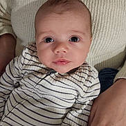 Cooper joined the competition — help win amazing prizes! baby, infant, striped_clothing, person, face, eyes, hand, sweater, knitwear, closeup, portrait, child, cute, skin, expression, indoor, holding, young, newborn, resting