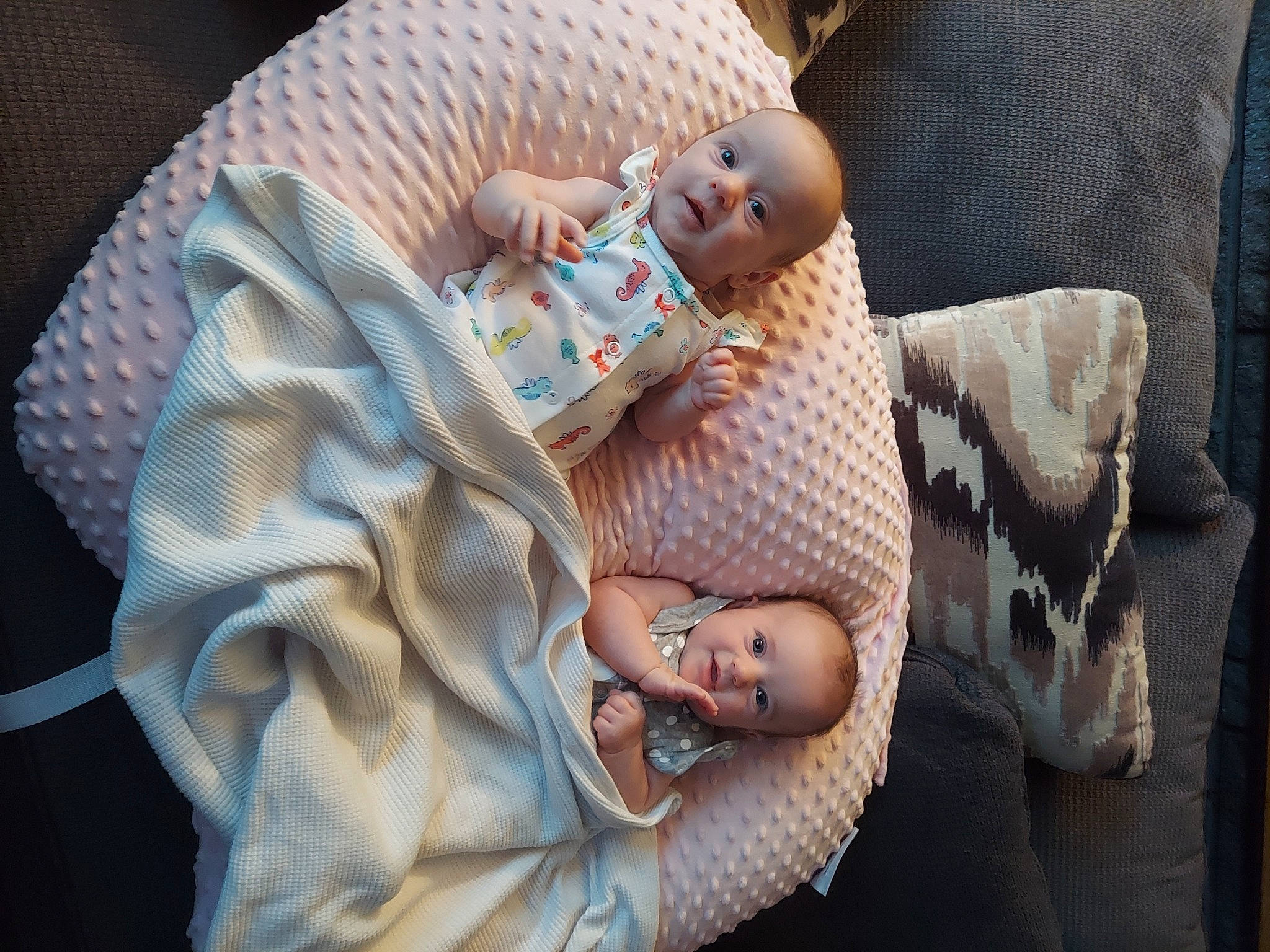 Catherine And Demitria is registered to the contest to win money with this photo: baby, baby_products, baby_sleeping, baby_toddler_clothing, child, comfort, couch, finger, foot, hand, hat, human_leg, linens, nail, pattern, person, product, sitting, skin, toddler